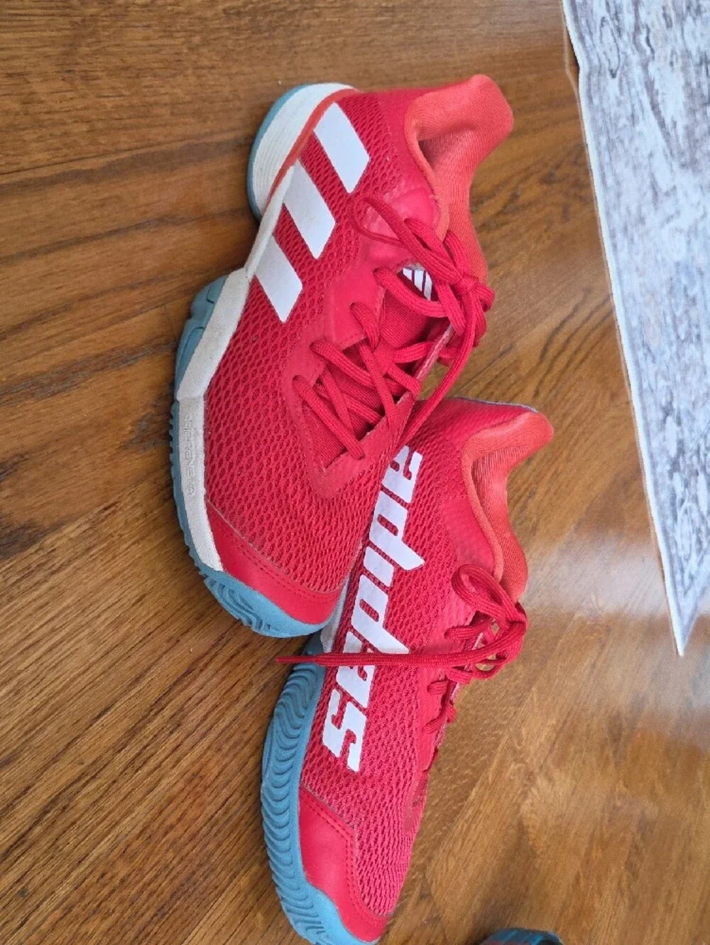 Red ADIDAS Tennis Shoes with Blue Soles